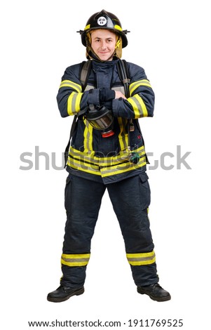 Young smiling fireman with mask and an air tank on his back in a fully protective suit with folded arms isolated on white background