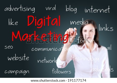 Business woman writing digital marketing concept. Blue background.