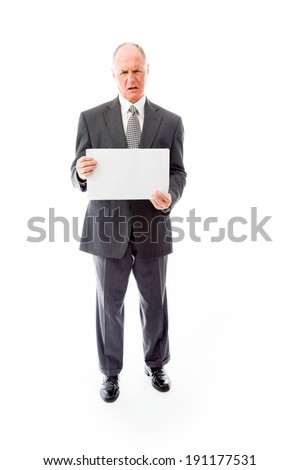 Frustrated businessman holding a blank placard