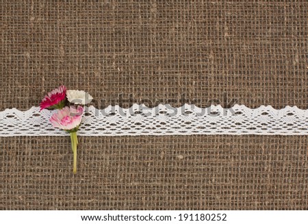 vintage postcard for text with daises in hessian cloth with white knitting stripe