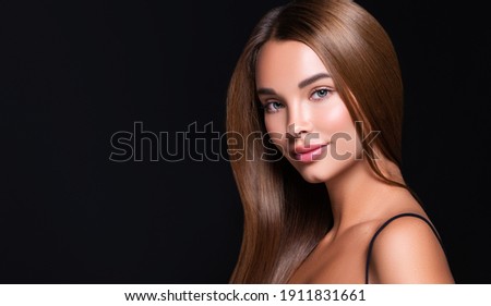 Beautiful model woman with shiny  and straight long hair. Keratin  straightening. Treatment, care and spa procedures. Beauty  girl smooth hairstyle Royalty-Free Stock Photo #1911831661