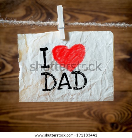 Text I love dad on the old paper and clothes peg wood background