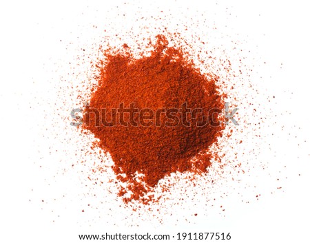 Paprika dried spice isolated on white background, top view Royalty-Free Stock Photo #1911877516