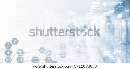 Virtual hospital, telemedicine, medical online, telehealth, healthcare and modern technology concept.  Medical icons on virtual screen and blurred hospital and patients as background Royalty-Free Stock Photo #1911898093
