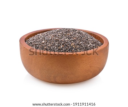 Chia seeds in brown wooden bowl isolated on white background.  Royalty-Free Stock Photo #1911911416
