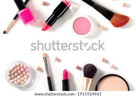 Make-up design template with brushes, pearls, lipstick and other products and tools. A flat lay on a white background with copy space