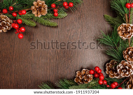 Wooden new year background, white surface, green tree, red berries