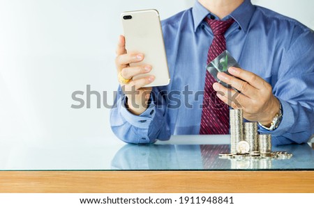 Online banking businessman using smartphone with credit card Transfer money,Fintech and Blockchain concept.