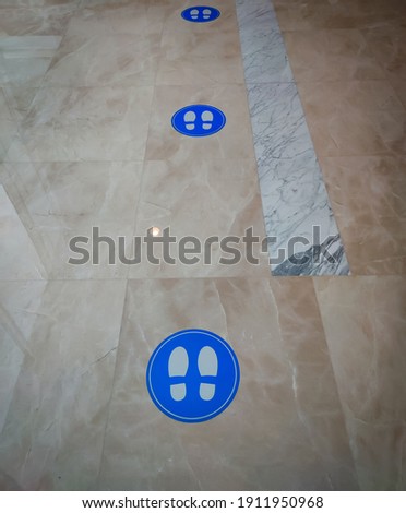 social distancing sticker sticking on the floor
