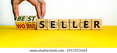 Worst or best seller symbol. Businessman flips wooden cubes and changes words 'worth seller' to 'best seller'. Beautiful white background, copy space. Business, worth or best seller concept.