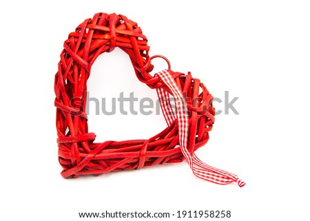 Decorative red wicker heart isolated on white background. Love. Life.