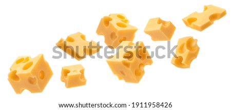 Falling cheese cubes, pieces of swiss emmental isolated on white background with clipping path Royalty-Free Stock Photo #1911958426
