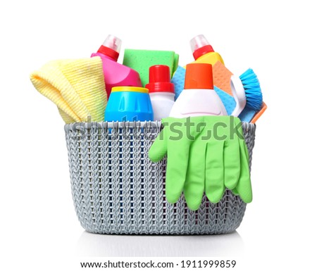Plastic basket with domestic desinfectant bottles and sprays.Household item isolated on white.Housekeeping object. Royalty-Free Stock Photo #1911999859