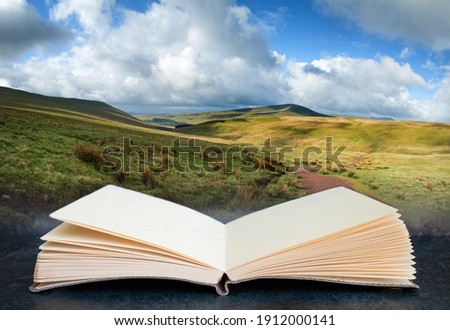 Digital composite image of Beautiful landscape of Brecon Beacons National Park in pages of open book