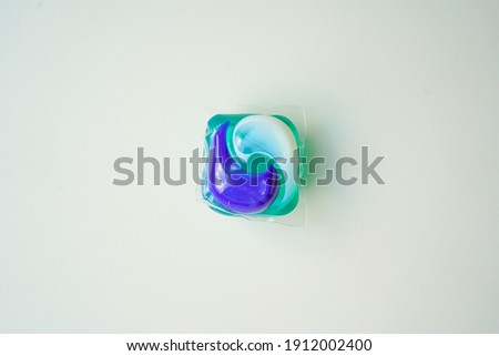 Washing gel capsule isolated on white background                            