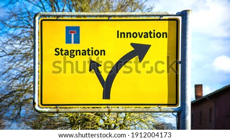 Street Sign the Direction Way to Innovation versus Stagnation Royalty-Free Stock Photo #1912004173
