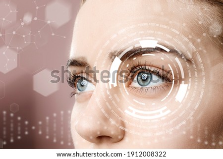Young woman with iris scanning, closeup Royalty-Free Stock Photo #1912008322