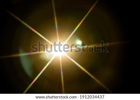 Abstract sun flare. The lens flare is subject to digital correction.