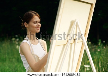 cheerful Woman in a white dress in nature draw on canvas