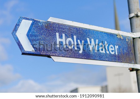 Sign directing pilgrims to holy water