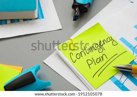 Business Contingency plan papers and notepad on the table. Royalty-Free Stock Photo #1912105078
