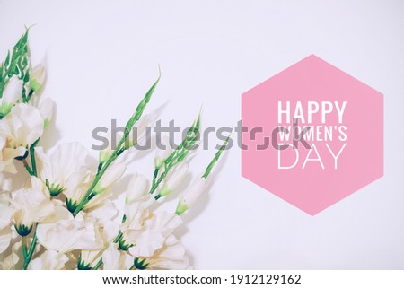 Happy women's day message with flowers bouquet in the white background. International women's day celebration. 