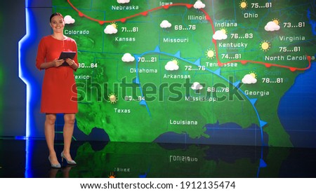 Live Weather News Studio with Professional Female On-Camera Meteorologist Standing Beside Screen and Making Gestures to Point at Weather Synoptic Map Chart for United States of America