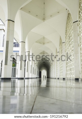 Silhouette man walking at corridor.