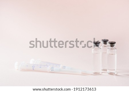 Vaccination and Immunization. Vaccine vials and clean syringes