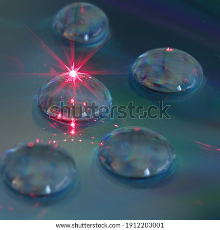 Laser in water droplets on cd