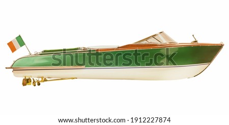 Side view of a two tone vintage Italian speedboat isolated on a white background Royalty-Free Stock Photo #1912227874