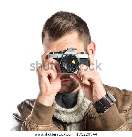 Man photographing a girl over white background 