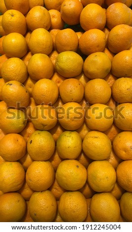An orange is a type of citrus fruit that people often eat.