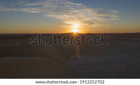  Aerial view of sunset in the desert at the Libyan-Algerian-Tunisian border.