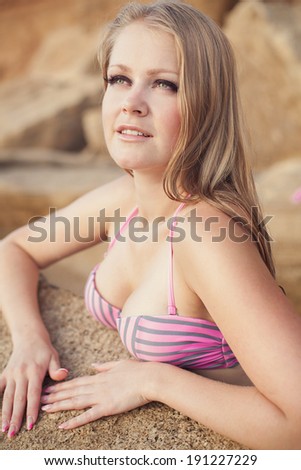 Young smiling woman on a beach