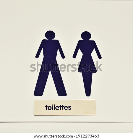 man and woman toilet sign in a restaurant