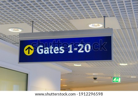 Sign at an airport for Gates 1-20.