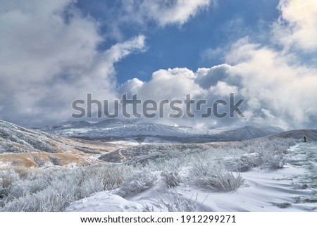Winter landscape. Scenery of Mount Aso. Shot in  Aso-Kuju National Park, Kumamoto Prefecture,Japan.                                      Royalty-Free Stock Photo #1912299271