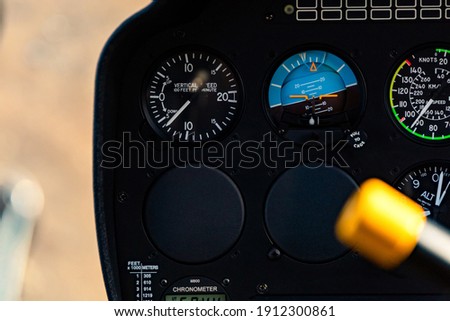 Helicopter control panel instruments. Equipment of Airline, gauge, speedometer, compass, navigation panel and other  round aircrafts in airplane or copter pilot cabin.  Royalty-Free Stock Photo #1912300861