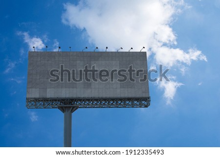 Blank billboard  with blue sky for an outdoor advertising poster, clipping path