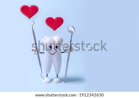 a cartoon model of a tooth, a dental mirror, a diagnostic probe and hearts on a blue background. the concept of the health of the oral cavity