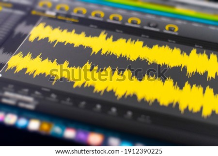 macro view of the computer monitor screen with sound audio wave graph volume