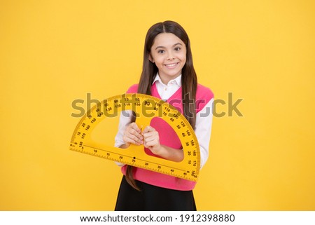 cheerful teen girl study math with protractor measuring size, back to school.