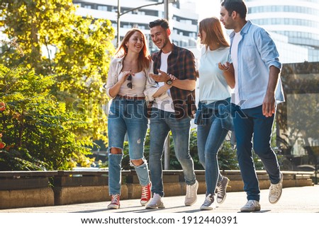 	
Group of young people hangout at the city street.They walks together and making fun.	
 Royalty-Free Stock Photo #1912440391