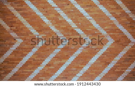 White and brown brick wall arrow texture background.