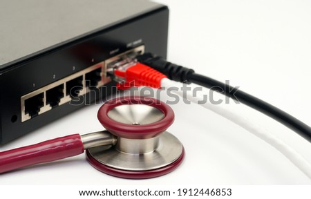 Stethoscope and router Concept of network maintenance.LAN network.