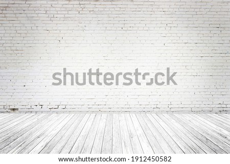 Empty Interior room with old white brick wall, wooden plank floor, used as studio background wall to display your products. Space for text and picture. Design ideas and style.