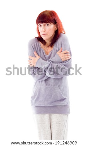 Mature woman shivering in cold
