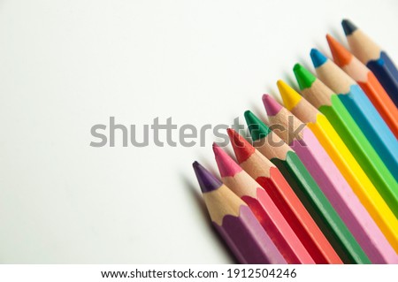 colored pencils on a white background. education concept. illustration of training.