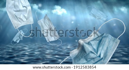 Face medical masks sinking underwater and polluting. Aquatic concept scene showing this environmental problem. Sun rays are reflecting and illuminate the seabed.